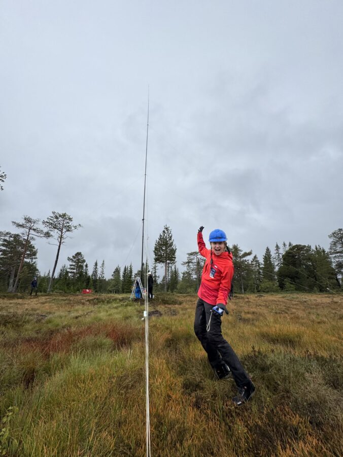 Person in front of the 80m vertical antenna.